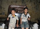 IMG 0848  Børn siddende på en gammel Richaw - Hoi An